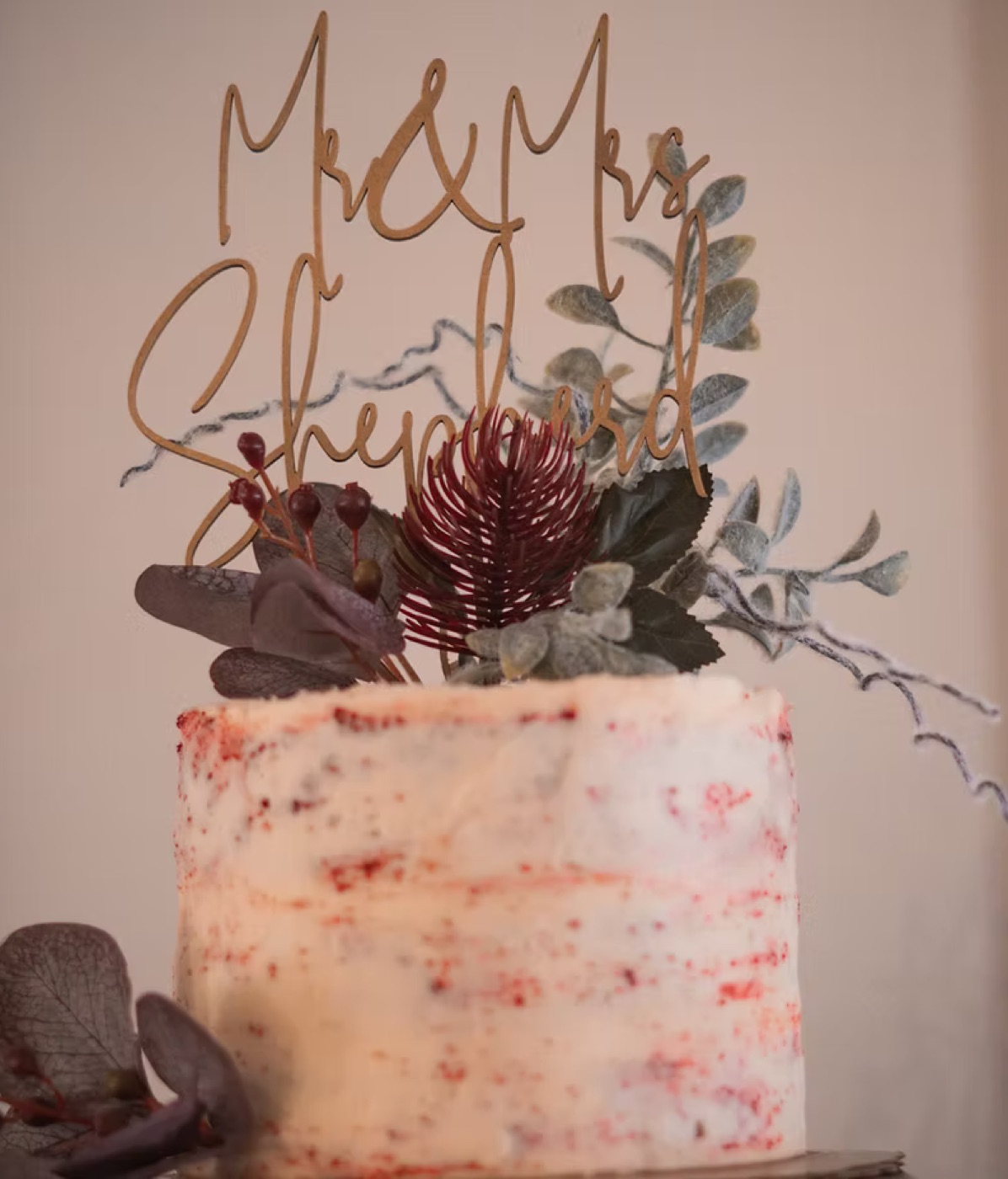 A finely styled celebration cake with dried florals